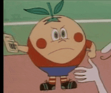 a cartoon character with a leaf on his head is being held by a hand