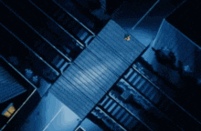 a cartoon character is flying through the air in a dark room