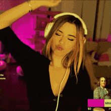 a woman wearing headphones is dancing in front of a pink background that says $ 866