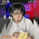 a man wearing headphones with the words big love park hyung jin written below him