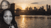a black and white photo of a woman standing next to a body of water