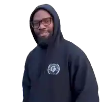 a man wearing a black hoodie with the letter e on the front