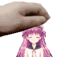 a pixel art of a hand putting a doll on top of another doll .