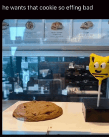 a picture of a cookie next to a lollipop that says he wants that cookie so effing bad