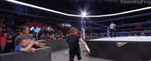 a man in a wrestling ring with the nextbigthing written on the bottom