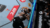 a fighter is laying on the ground with a ufc sign in the background