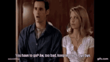 a man and a woman are standing next to each other and talking . the woman is asking the man if he has to go .