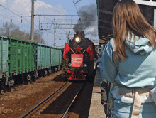 a train with a sign that says " с днем победы " on the front
