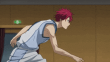 a basketball player with red hair has the number 9 on his shirt