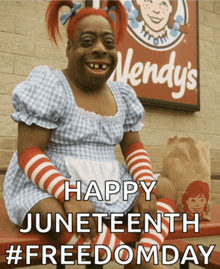 a wendy 's sign is behind a person dressed in a wendy 's costume
