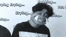 a black and white photo of a man with the words " crying " on the wall behind him