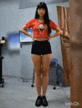 a woman wearing a red shirt with a cartoon character on it