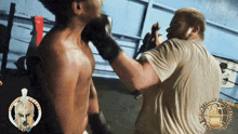 a man wearing boxing gloves is being punched by another man in a boxing ring