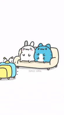 a blue cat and a white rabbit are sitting on a couch watching a tv .
