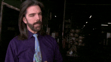 a man in a purple shirt and blue tie says i had somebody draw a analogy for me once