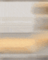 a blurry picture of a person 's face with a gray and yellow background