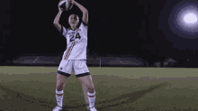 a female soccer player with the number 24 on her shirt