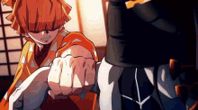 a close up of a person 's fist being punched in the face .