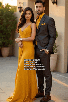 a man in a suit and a woman in a yellow dress pose for a picture