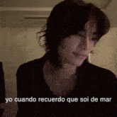 a woman with short hair is making a funny face while talking in spanish .
