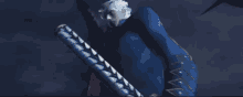 a man in a blue suit is holding a large sword in his hand .