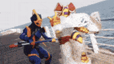 a cartoon character is fighting another cartoon character on a pier