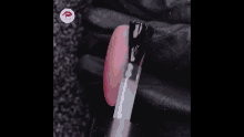 a box filled with sequins with a lipstick logo on it