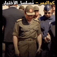 a man in a military uniform stands in front of a group of men in suits