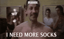 a shirtless man says i need more socks in a blurry photo