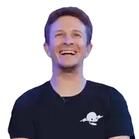 a man wearing a black shirt with a skull and crossbones on it is laughing