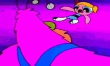 a pink and blue circle is glowing in the dark