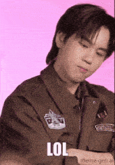 a man wearing a brown jacket with a patch that says " lol "