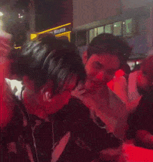 a crowd of people are dancing in front of a building that says romance walker