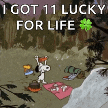 a cartoon of snoopy and woodstock having a picnic with the words " i got 11 lucky for life " above them