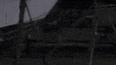 a man is running in front of a boat .