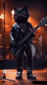 a black cat in a leather jacket is playing a bass guitar on a stage .