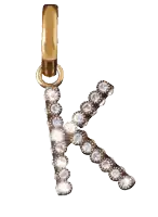 a gold letter k is surrounded by diamonds