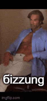 a shirtless man in a blue shirt is sitting in a chair with the word gizzung on the bottom
