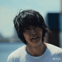 a close up of a man 's face with a netflix logo in the corner
