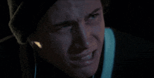 a close up of a person 's face with earbuds in their ears