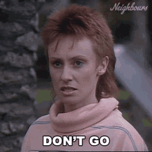 a woman in a pink sweater says don 't go