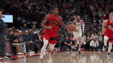 a basketball player with the number 30 on his jersey is dribbling the ball