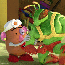 a picture of mrs. potato head and a green toy from toy story