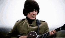 George Harrison GIF - George Harrison Guitar Play GIFs