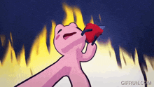 a cartoon of a pink frog holding a red heart in its mouth .