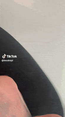 a close up of a person 's leg with a tiktok sticker