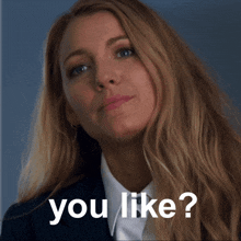 a woman in a suit says " you like " in front of her face