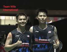 two badminton players are posing for a picture with the words team wife international on the bottom
