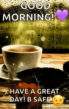 a cup of coffee and a strawberry on a saucer on a table with a good morning message .