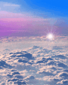 the sun is shining through the clouds in a blue sky